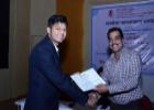 Participant receiving the certificate from Shri Rakesh Garg, Secretary, Textiles Committee